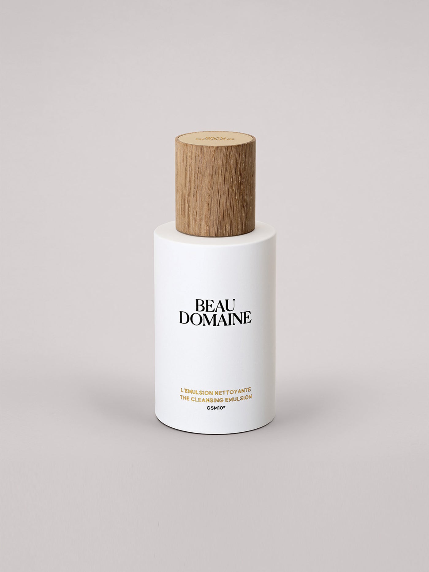 White bottle with wooden cap labeled 'Beau Domaine' on a light gray background