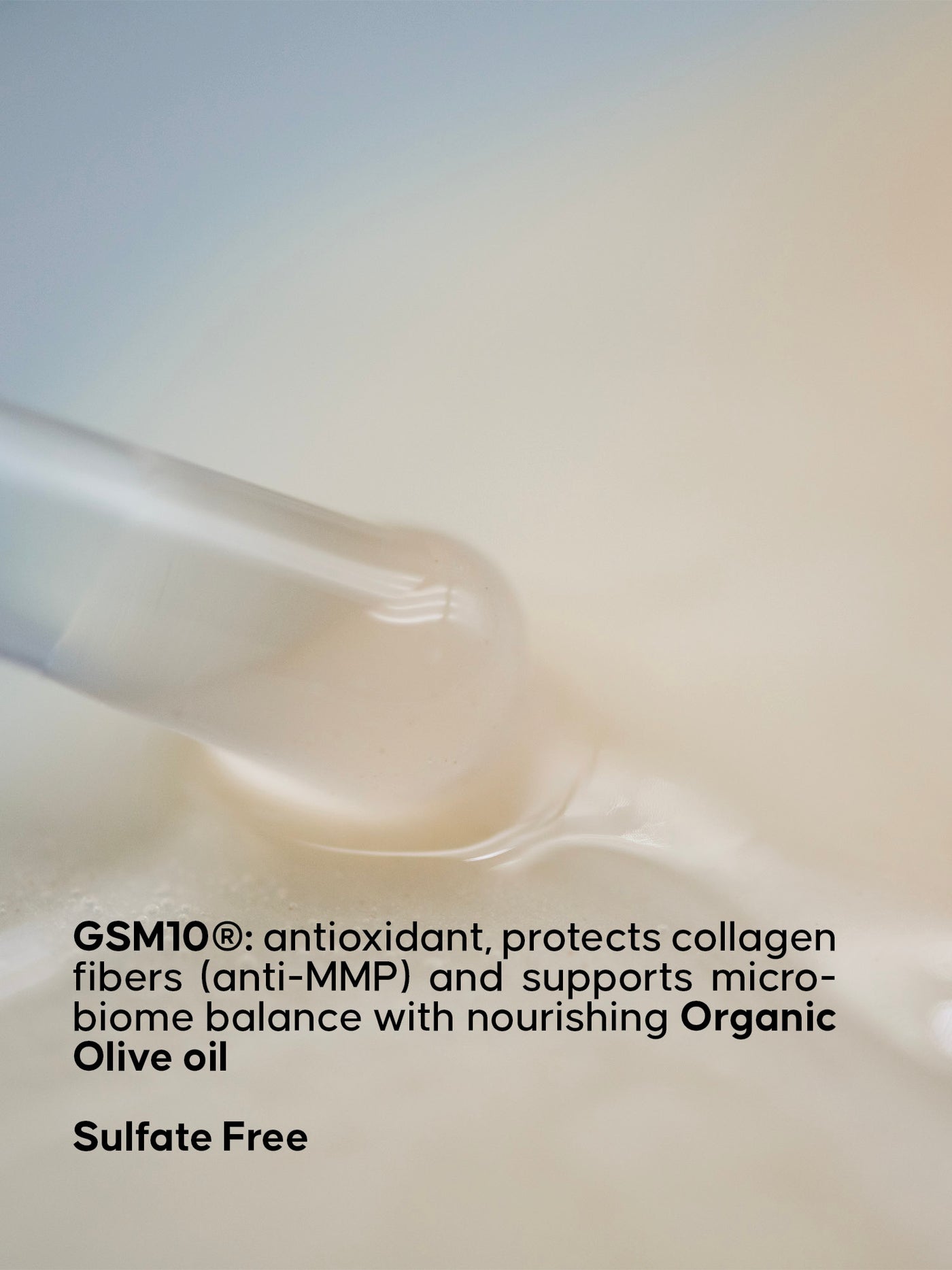 Cream texture with text about GSM10 antioxidant properties on a blurred background. Text indicating the product is sulfate free